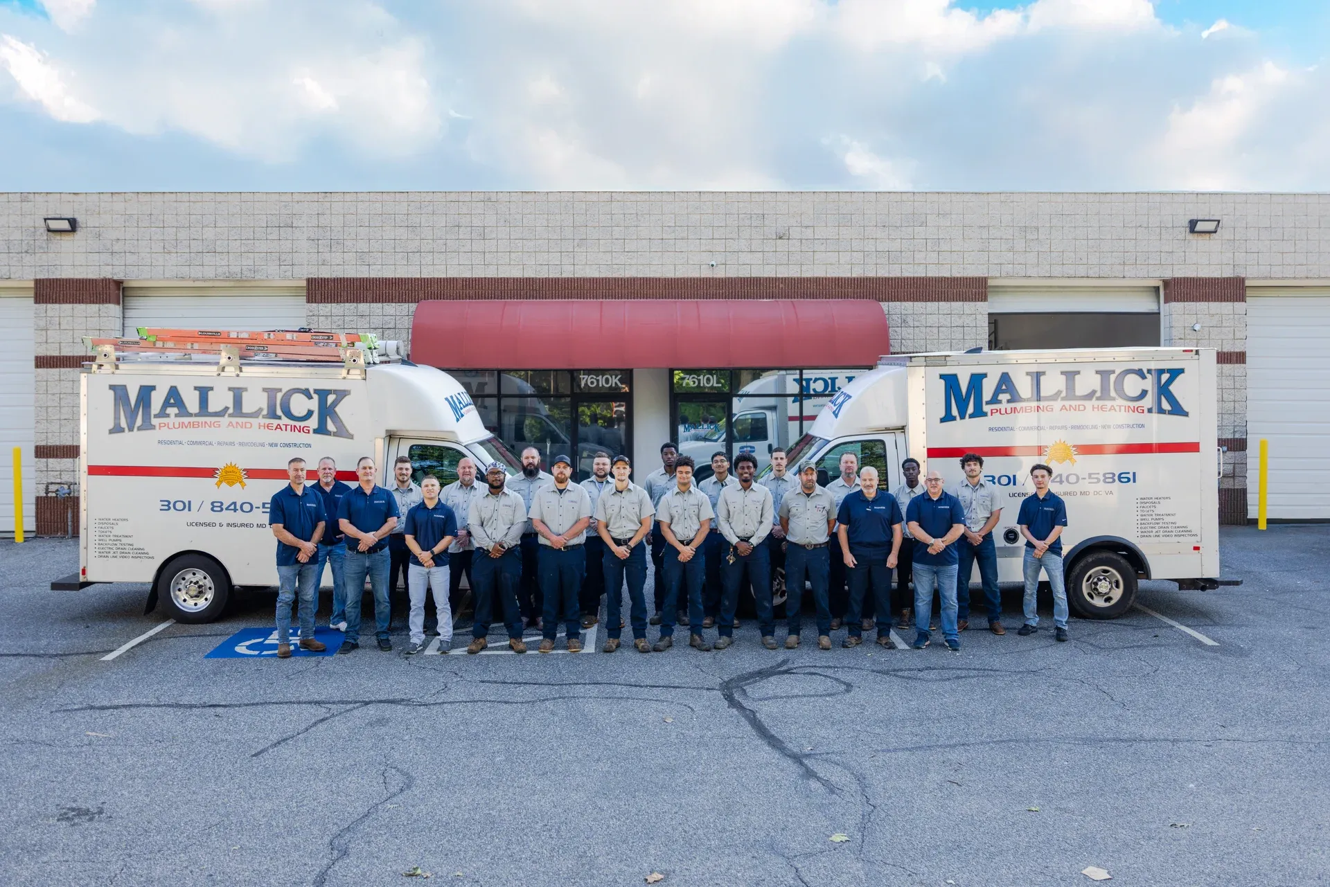 Mallick Plumbing & Heating commercial team with service trucks