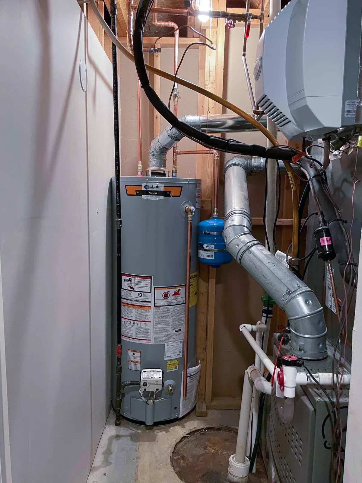 Natural-draft gas tank water heater installed by Mallick Plumbing & Heating