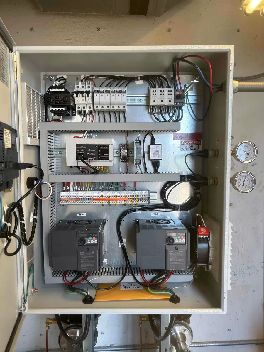 Booster pump control panel installed by Mallick Plumbing & Heating